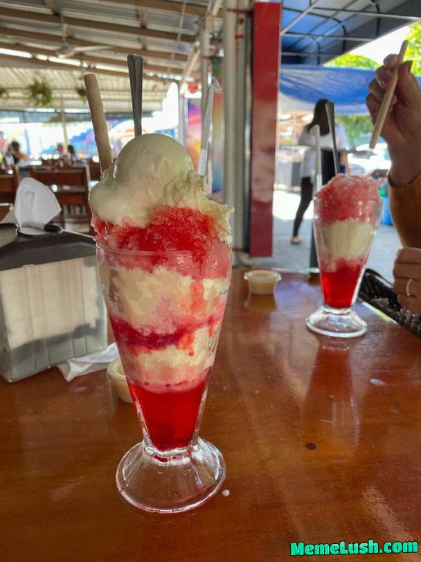 This is called a “Churchill”. Ice chips (slushy?) with cola flavour, with layers of condensed milk, powdered milk, and ice cream This is called a “Churchill”. Ice chips (slushy?) with cola flavour, with layers of condensed milk, powdered milk, and ice cream