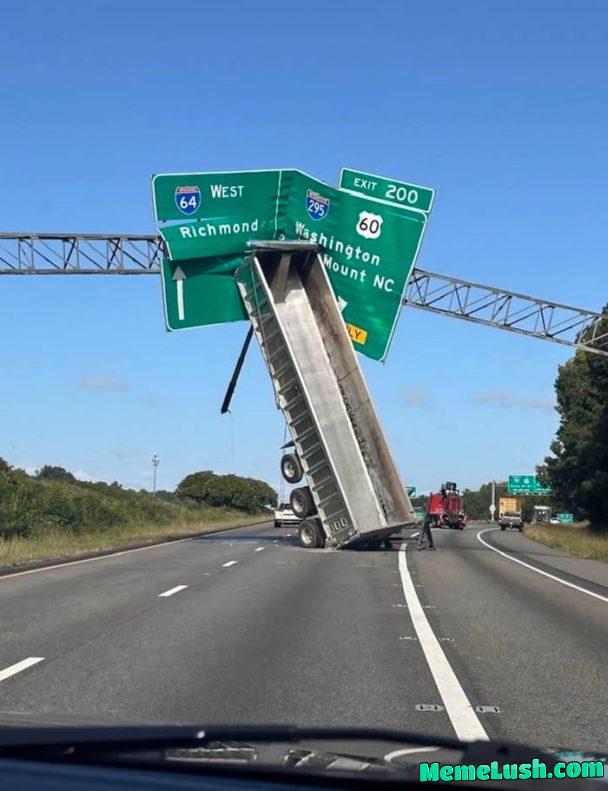 Tractor trailer takes out highway sign on I-64. Tractor trailer takes out highway sign on I-64.