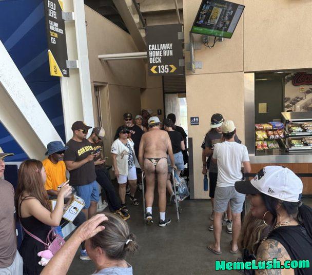 Hot day at the baseball stadium so he had to dress accordingly Hot day at the baseball stadium so he had to dress accordingly